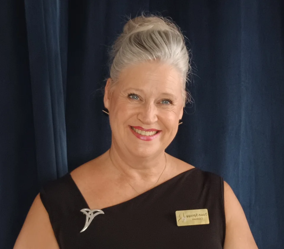 Dawn Spragg smiling in her celebrant outfit